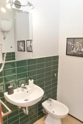 a bathroom with a sink and a toilet at Colazione Al Vaticano Guest House in Rome