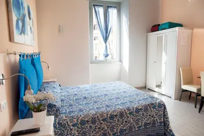 a hotel room with a bed and a window at Merulana Suite in Rome
