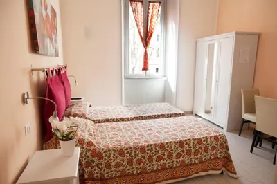 a bedroom with a bed and a window at Merulana Suite in Rome