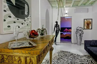 a living room with a table and a couch at Pantheon Relais in Rome