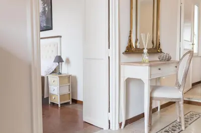 a bedroom with a white desk and a mirror at Pellegrino 75 Double Bedroom in Rome