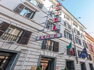 a sign on the side of a building at Raeli Hotel Luce in Rome