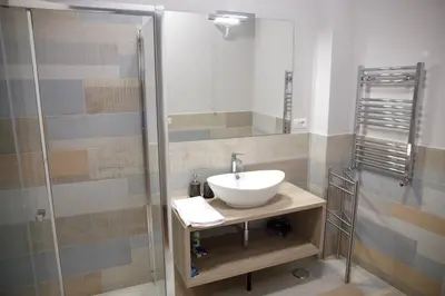 a bathroom with a sink and a shower at Vista Cupola House in Rome