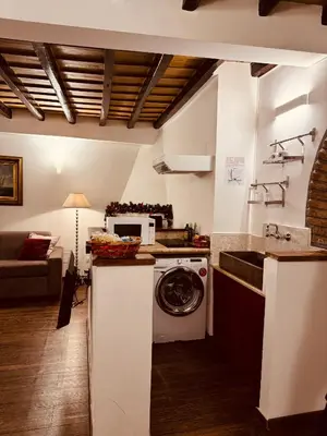 a kitchen with a washing machine and a sink at Loft In Rome Termini-Colosseum in Rome