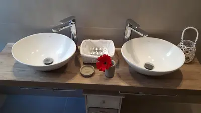 two white sinks on a counter in a bathroom at Jubilee 3 Luxury apartment in Rome Vatican in Rome