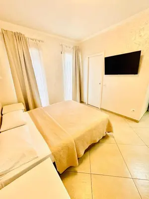 a bedroom with a bed and a flat screen tv at Dodo Holiday in Rome in Rome