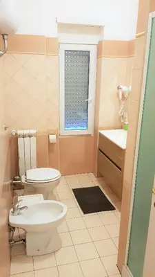 a bathroom with a toilet and a sink at Dodo Holiday in Rome in Rome