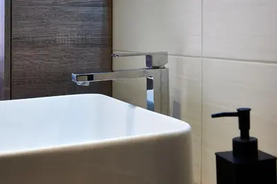 a sink with a faucet in a bathroom at Good Vibes Rome comfort and quality in Rome