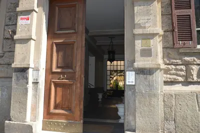an entrance to a building with a wooden door at Apartment Silvestri in Rome