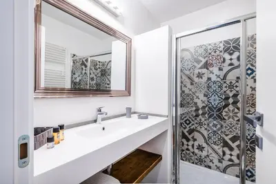 a bathroom with a sink and a mirror at Giselda Home in Rome
