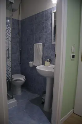 a bathroom with a sink and a toilet at Mila Guest House in Rome