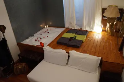 a bed in a room with a bath tub at Jacuzzi Rooms in Rome