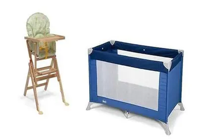 a blue cabinet and a chair next to a table at LA PERLA RARA Vatican Sweet Home in Rome