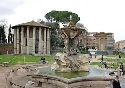 a fountain in a park with people walking around it at LA PERLA RARA Vatican Sweet Home in Rome