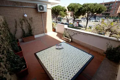 a bench on a balcony with a view of a street at Heart of Rome Rooms in Rome