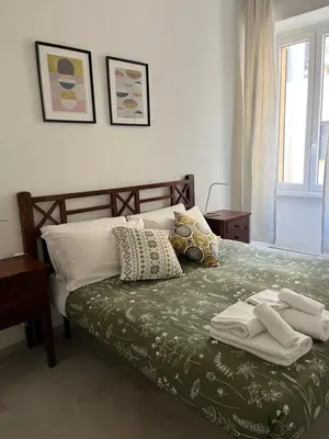 a bedroom with a bed with towels on it at Le Naiadi in Rome