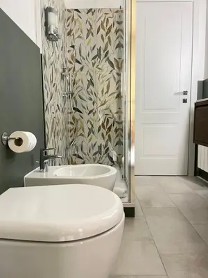 a bathroom with a toilet and a sink and a shower at Le Naiadi in Rome