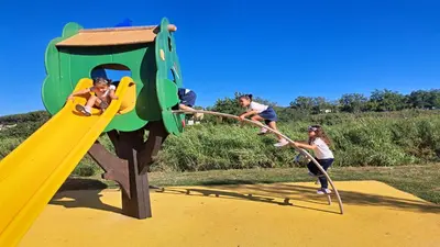 a group of children playing on a playground at Eco B&B Marela in Rome