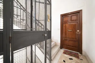 a door with a cage next to a wooden door at Rome Sweet Home near Metro Flaminio in Rome