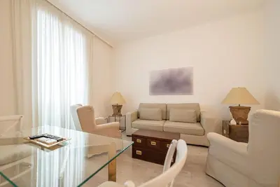 a living room with a couch and a glass table at Rome Sweet Home near Metro Flaminio in Rome