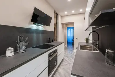 a kitchen with a sink and a counter top at LuMa Suite Via Veneto - Your luxury style 22 in Rome