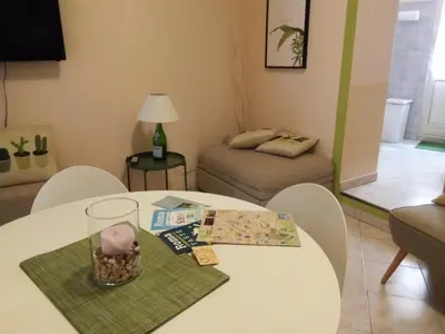 a living room with a table and a couch at Apartment Rome & More in Rome