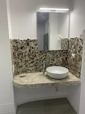 a bathroom with a sink and a mirror at Caos Calmo in Rome
