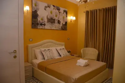 a bedroom with a bed and a chair at Rome Innitaly Affittacamere o GuestHouse in Rome
