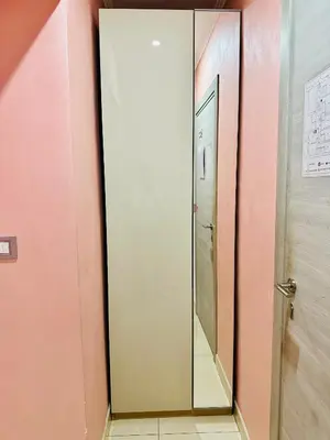 a large mirror in a bathroom with pink walls at Rome Innitaly Affittacamere o GuestHouse in Rome