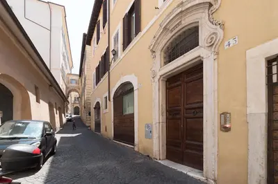 a car parked on a street next to two buildings at Trevi's Roof Terraces in Rome
