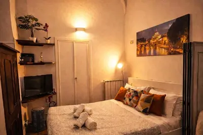 a bedroom with a bed with stuffed animals on it at NAVONA & CASTEL SANT'ANGELO WHOLE HOLIDAY APARTMENT da PAMINO & PRISCILLA in Rome