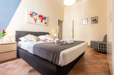 a bedroom with a large bed in a room at Elegant Apartment in the Center of Rome! in Rome