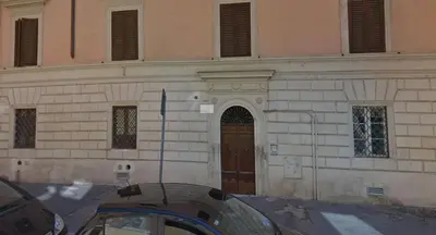 a building with a car parked in front of it at TRASTEVERE - STUDIO APT. x 2 in Rome