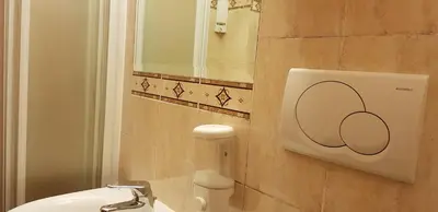 a bathroom with a sink and a mirror at Holiday Roma in Rome