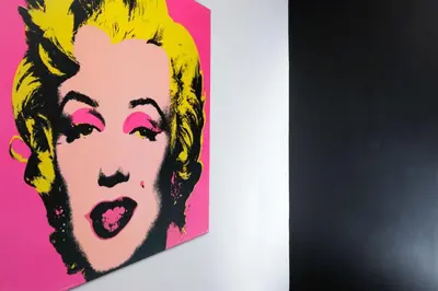 a painting of a woman on a pink wall at Suite Art Navona in Rome