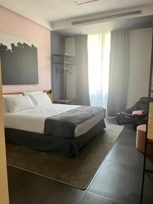 a bedroom with a large bed in a room at STAY FINE Holiday’s House in Rome