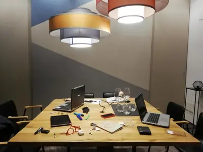 a wooden table with two laptops on top of it at STAY FINE Holiday’s House in Rome