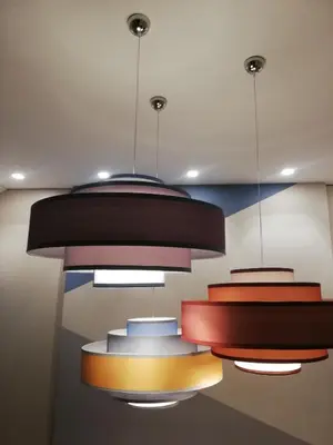 a group of lights hanging from a ceiling at STAY FINE Holiday’s House in Rome