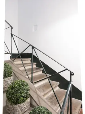 a staircase with a metal railing and some plants at PantheonDreamSuite in Rome