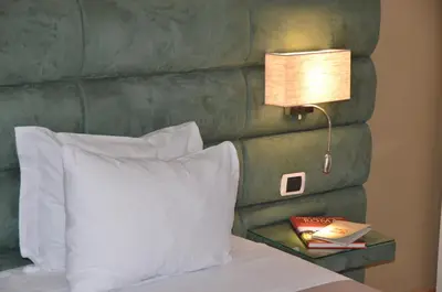 a mirror on top of a table with a lamp at Sweet Home Parioli in Rome