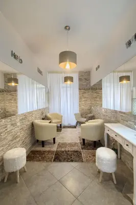 a waiting area with chairs and tables in a lobby at Vatican Treasure in Rome