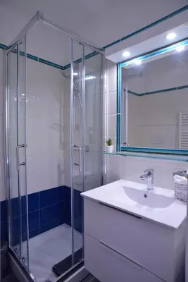 a bathroom with a sink and a glass shower at Livia B&B - Trastevere in Rome