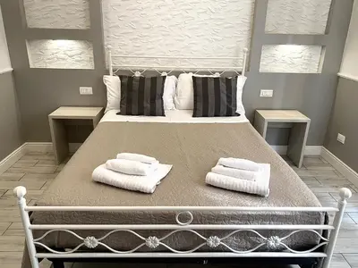 a bedroom with a bed with towels on it at Residenza Giustiniani in Rome