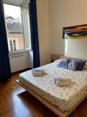 a bedroom with a bed with two towels on it at ColosseoDreamApartment in Rome
