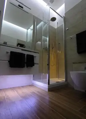 a bathroom with a shower and a sink at Poliziano Apartment in Rome