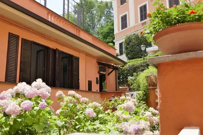 a building with flowers in front of a building at La Casa nel Borgo in Rome