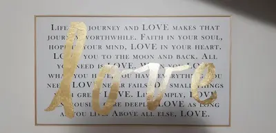 a picture of a sign with the word love at Ponte Milvio Luxury House in Rome