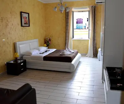 a bedroom with a bed in a room with a window at VaticanSky rooms in Rome