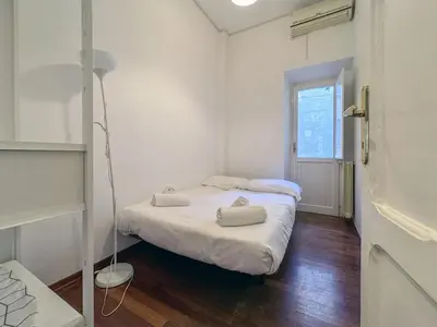 a small room with two beds in it at JHHIT San Pietro Modern Suite in Rome