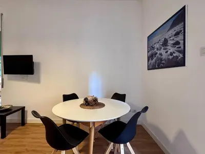 a table with chairs and a hat on top of it at JHHIT Tuscolana Suite 03 with Terrace in Rome